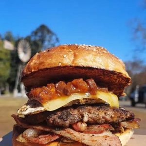 Burger with beef cheese bacon relish onion egg