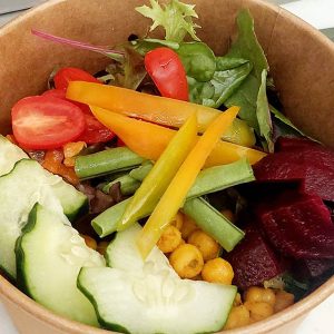 Buddha bowl of cucumber, tomatoes, beans, beetroot, lettuce, capsicum, chickpeas