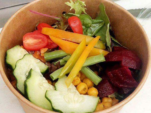 Buddha bowl of cucumber, tomatoes, beans, beetroot, lettuce, capsicum, chickpeas